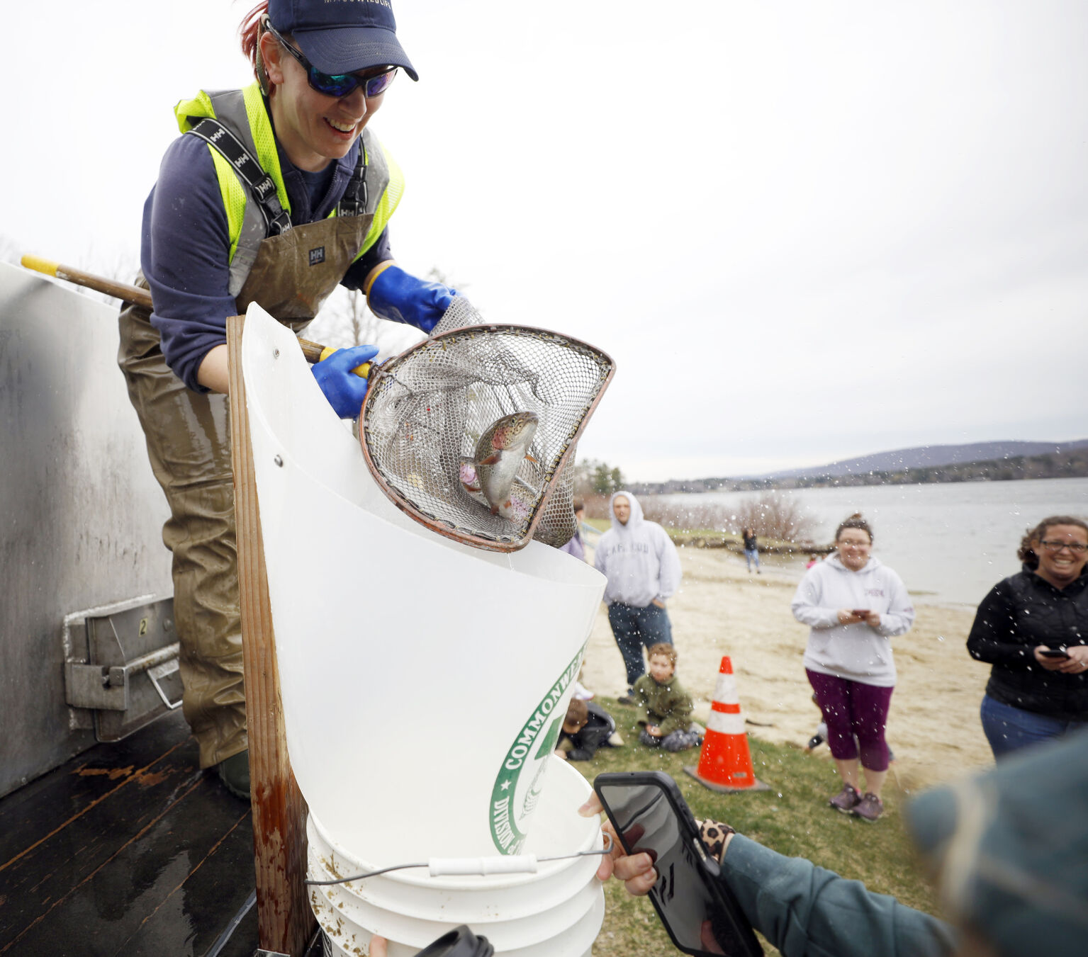 leanda fontaine putting trout into bucket
